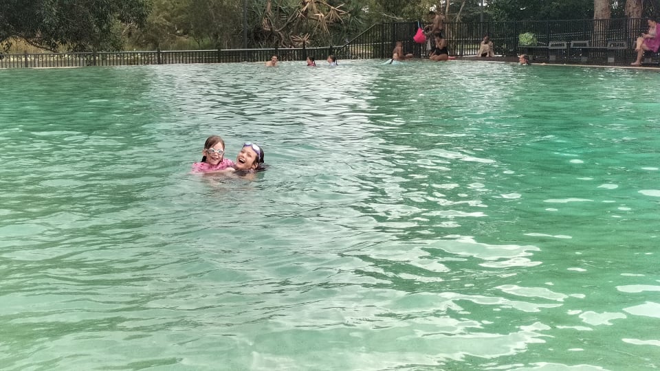 Ayla and Romy swim at Riverway Lagoons in Townsville.