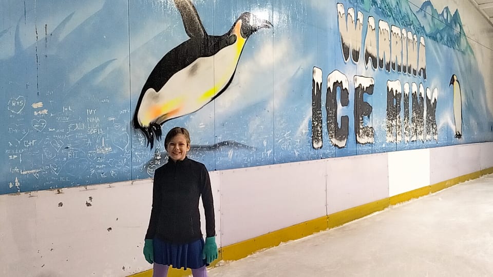 Ayla stops for a photo inside Warrina Ice Skating Rink in Townsville.