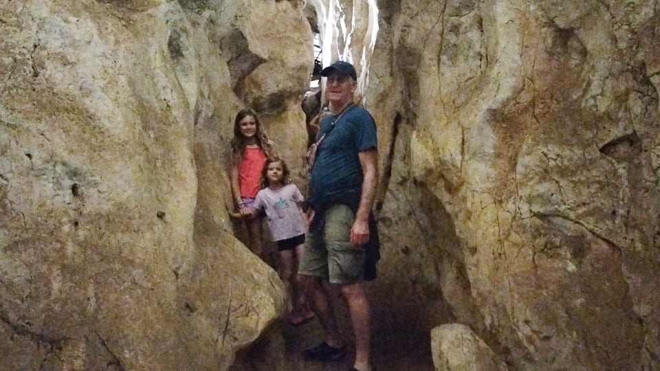 Colin, Ayla, and Romy exploring on the Cathedral Cave Tour at the Capricorn Caves near Rockhampton.
