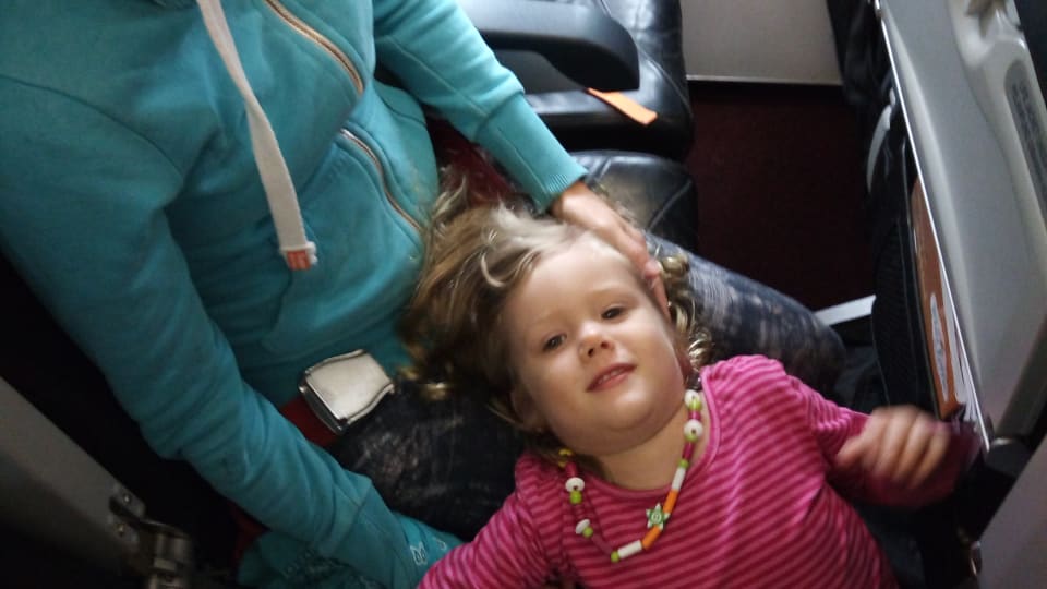 Elly and Ayla in an airplane.
