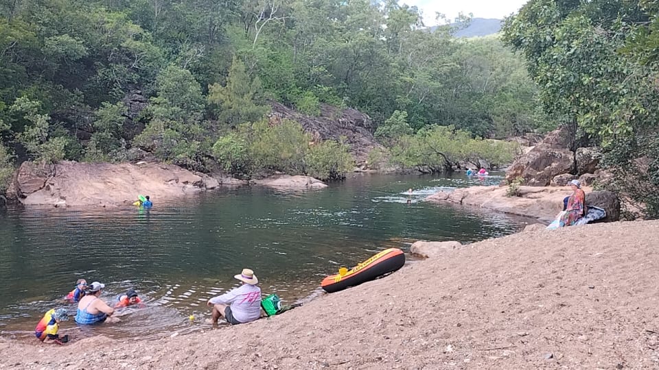 People relax at the Alligator Creek day use area, a fantastic swimming hole near Townsville.
