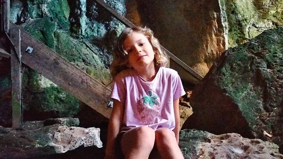 Romy inside a cave on the Cathedral Cave tour at the Capricorn Caves near Rockhampton
