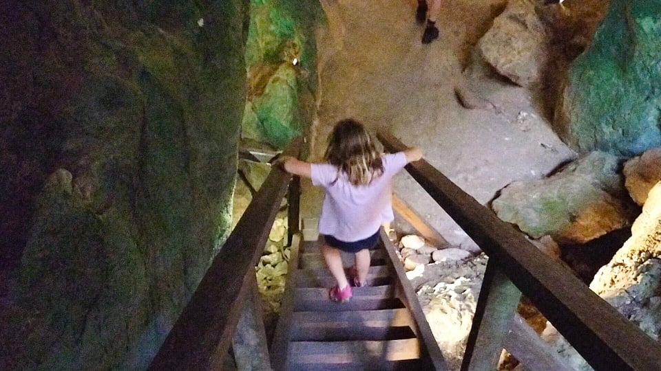 Romy walks down stairs on the Cathedral Cave Tour at the Capricorn Caves near Rockhampton.