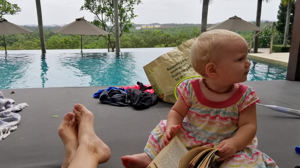 A view of Elly's feet and baby Romy relaxing at a condo poolside in Johor Bahru, Malaysia.