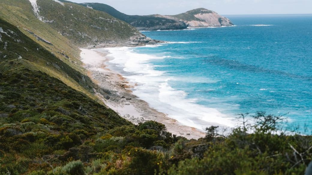 Stunning panorama of Torndirrup’s rugged coastline as powerful waves pound the rocky shore.