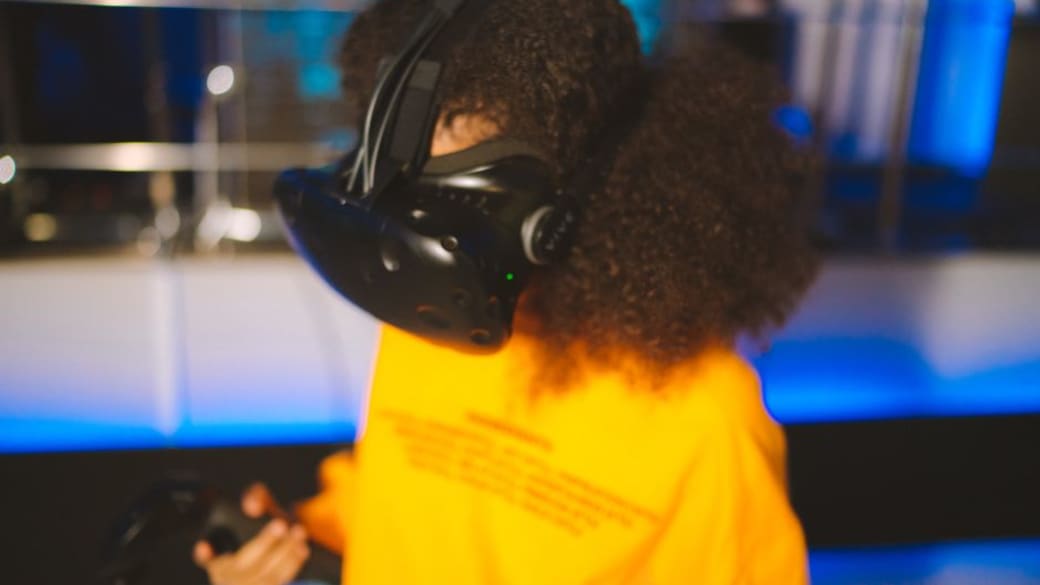 Child playing with interactive augmented reality (AR) toys.