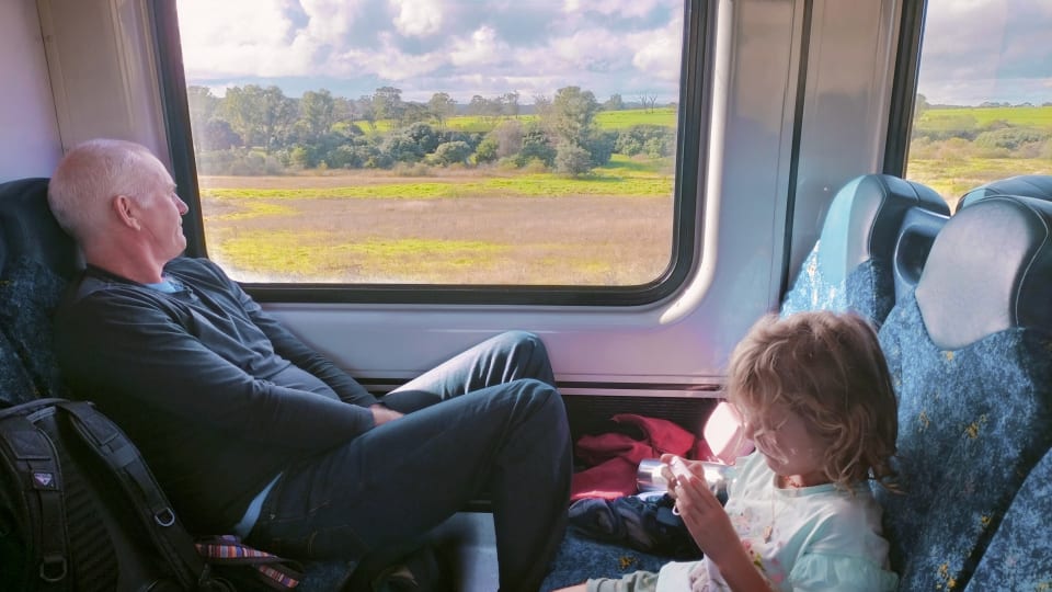 Colin and Romy on an intercity train in Australia.