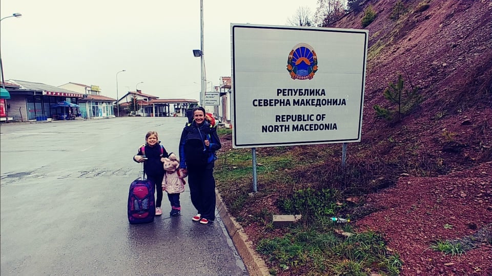 Elly, Ayla, and Romy crossing a land border into North Macedonia.