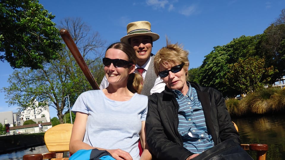 Elly and Anne enjoy punting on the Avon River in Christchurch on a blue sky day.