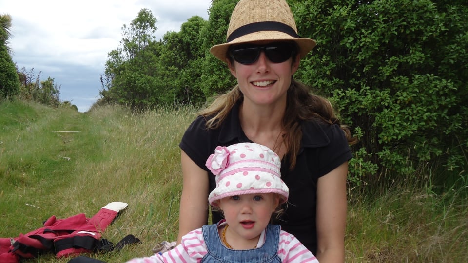 Elly and Ayla relax with a book on Quail Island, a fantastic day trip from Christchurch.