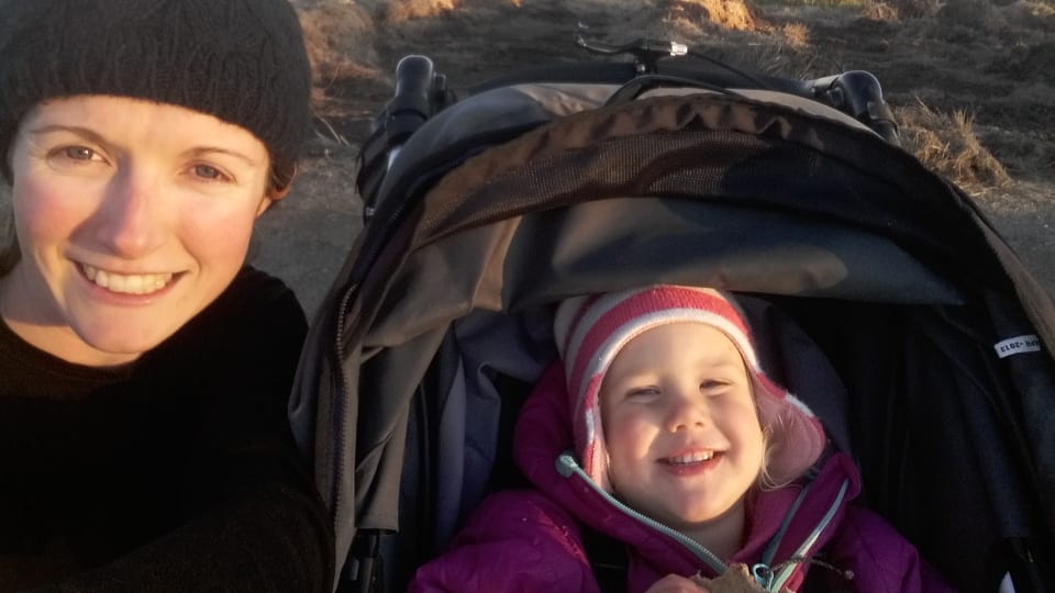 Elly takes a jog through Travis Wetlands in Christchurch, with Ayla in the buggy.