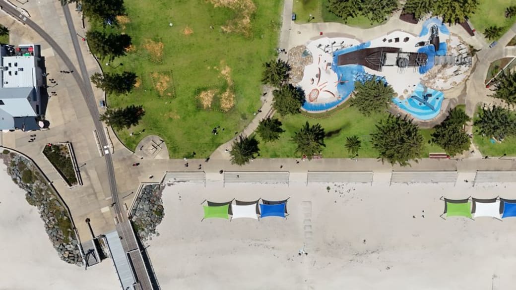 Explore the beautiful aerial view of Busselton's beach, park, and water playground in Western Australia.
