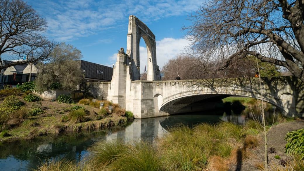 Scenic view of the Bridge of Remembrance in Cashel Street, Christchurch, New Zealand, spanning the Avon River.