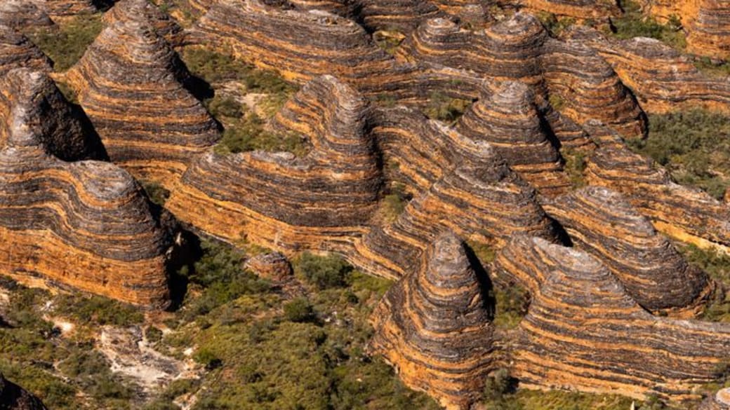Stunning aerial view of the Bungle Bungle Range's striped domes in Purnululu, Australia.