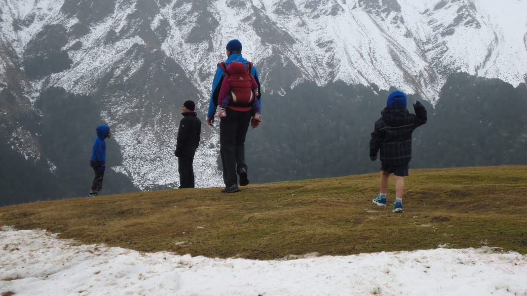 Colin and friends hike amid a snowy landscape near Queenstown, New Zealand.