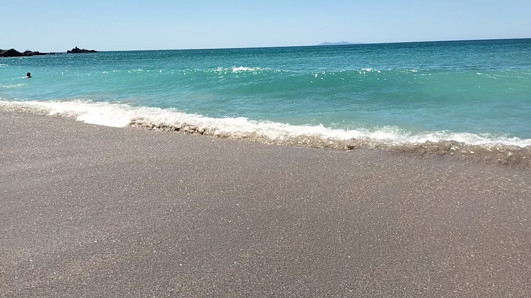 Turquoise coloured waters at Mount Maunganui surf beach.