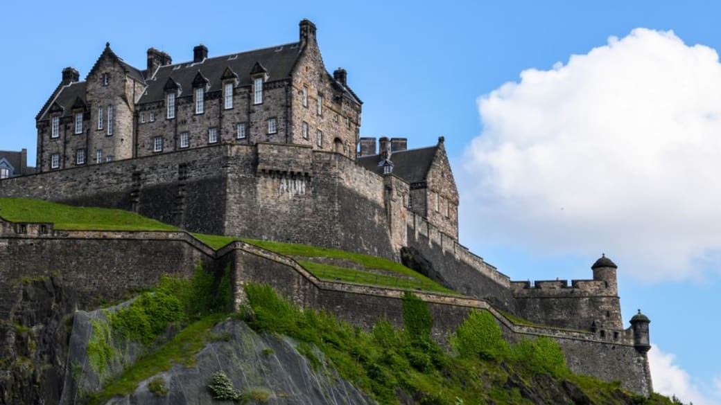 View up to Edinburgh Castle perched atop Castle Rock in Scotland.