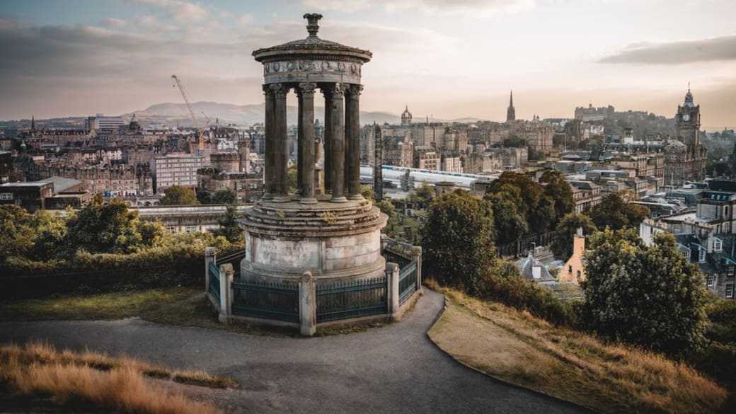 Captivating view from Calton Hill in Edinburgh showcasing historic architecture at sunset.