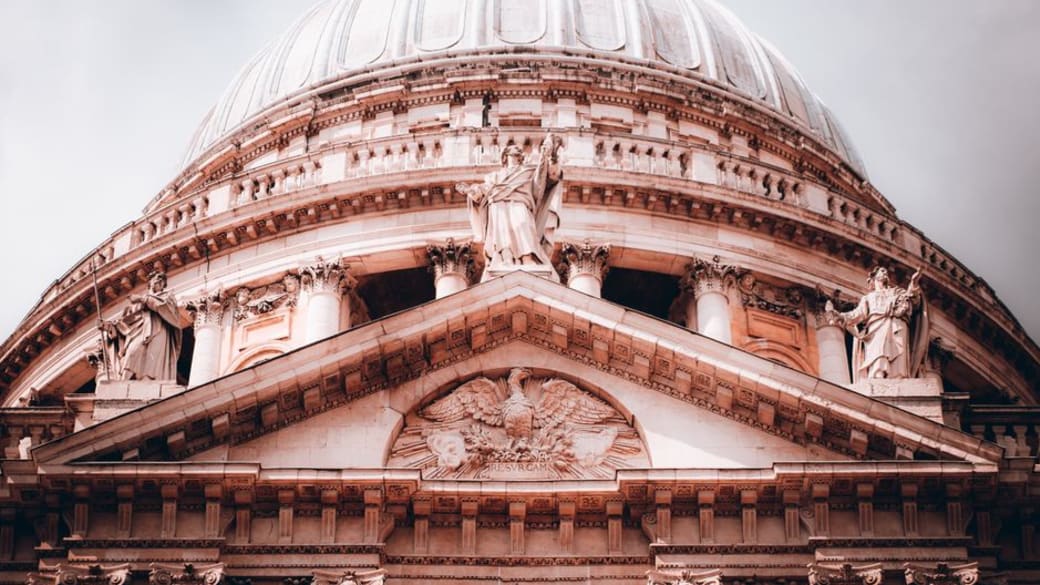 Detailed view of St. Paul's Cathedral dome in London, showcasing its intricate historical architecture.