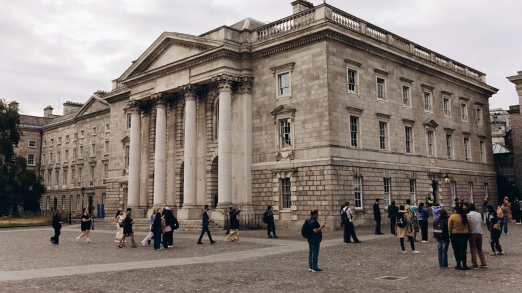 Elegant view of Trinity College's neoclassical architecture in Dublin, Ireland.