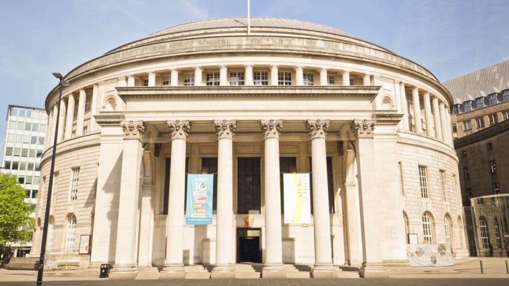 Front view of Manchester Central Library, showcasing its neoclassical architecture.