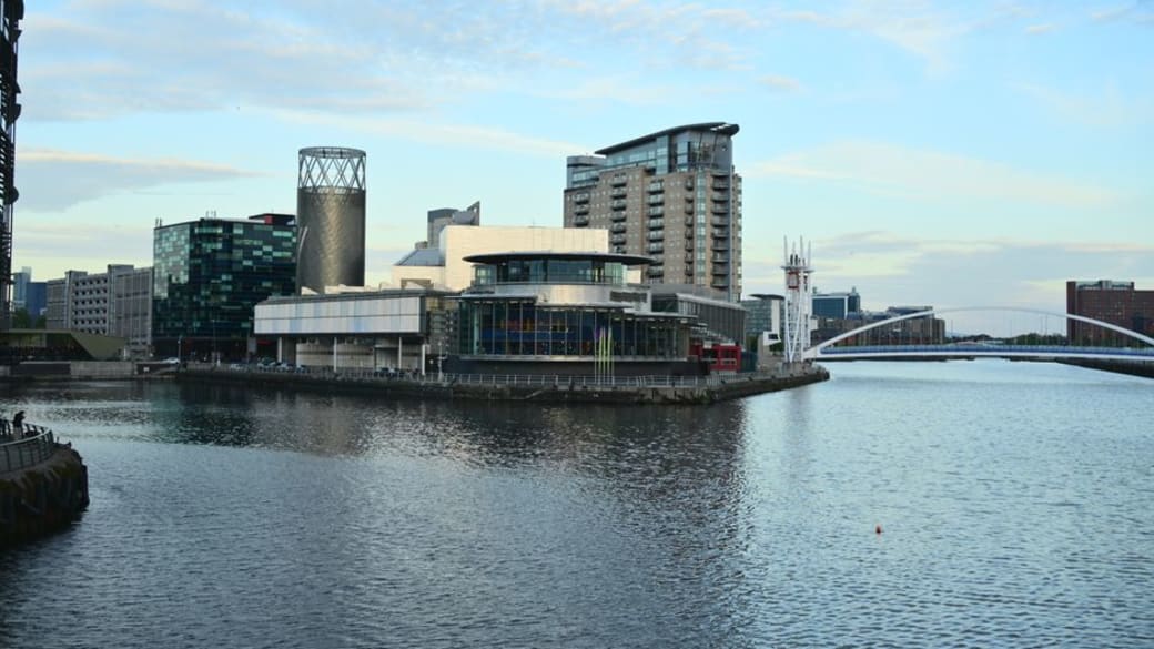 Skyline view of modern architecture along the waterfront in Manchester, UK.