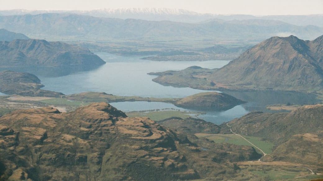 Stunning aerial photograph of Lake Wanaka surrounded by New Zealand's majestic mountains and valleys.