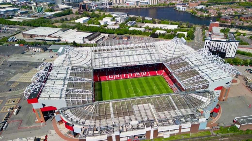 Aerial shot of Old Trafford stadium showcasing its distinctive design.