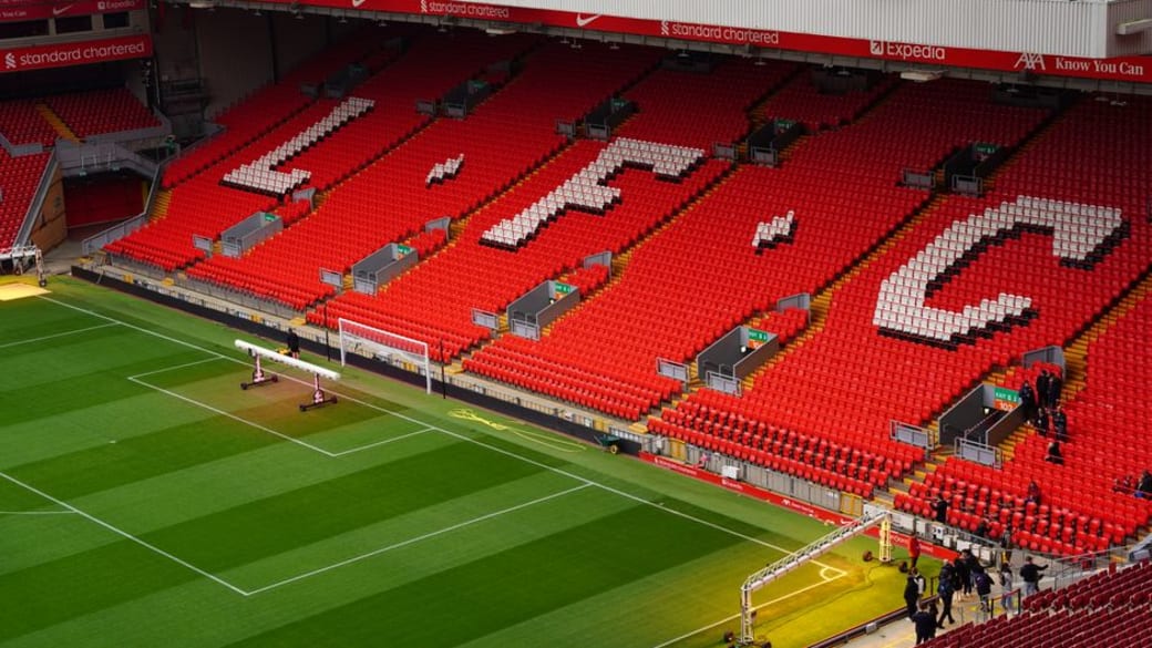 View of Anfield Stadium seating with prominent LFC letters. Perfect capture of iconic Liverpool FC venue.
