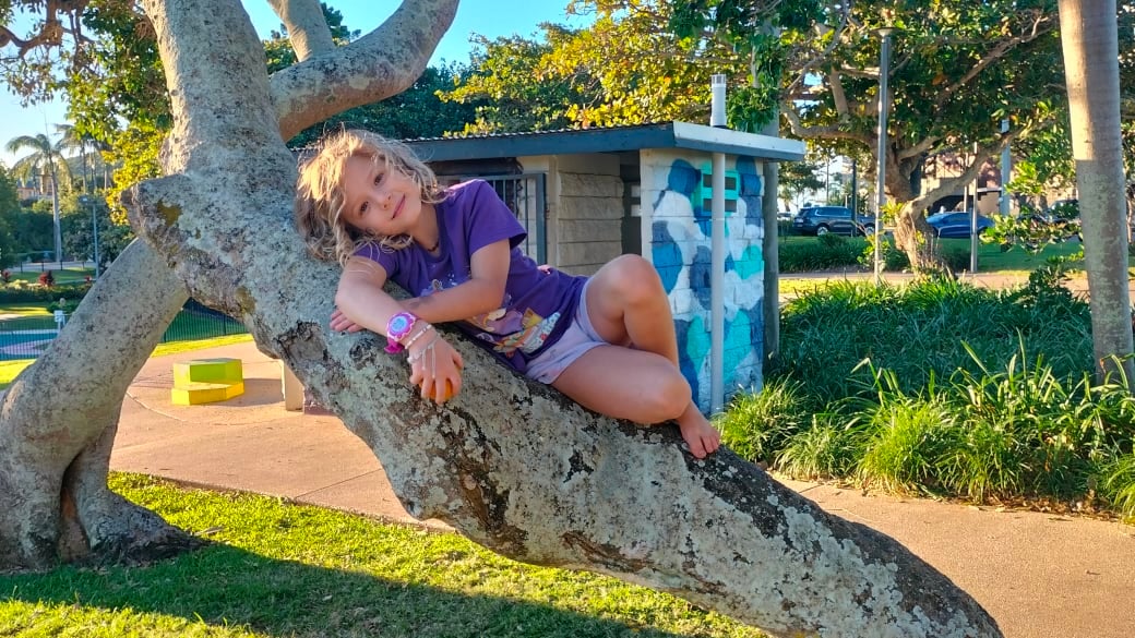 Romy lying in a tree at Appleton Park in Yeppoon.